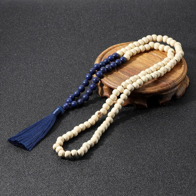 Collier de perles mala en bois avec pompon style macramé